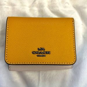 Coach Trifold multi color wallet.